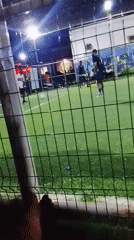 Nighttime soccer match played on artificial turf in Akwanga