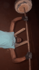 Man uses homemade gym equipment for outdoor workout in Bukuru