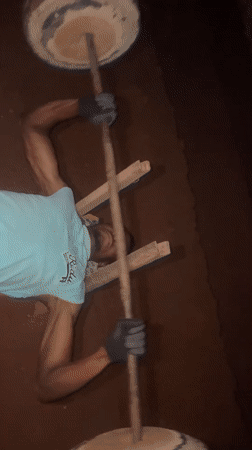 Man uses homemade gym equipment for outdoor workout in Bukuru