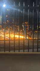 Nighttime metal work and street scenes documented in Abuja