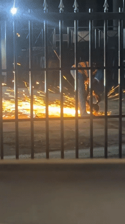 Nighttime metal work and street scenes documented in Abuja