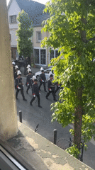 European town hosts ceremonial military and musical procession