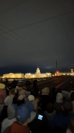 Nighttime crowds gather for apparent performance event in Saint Petersburg