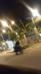Nighttime street scene recorded from moving vehicle in Dar es Salaam