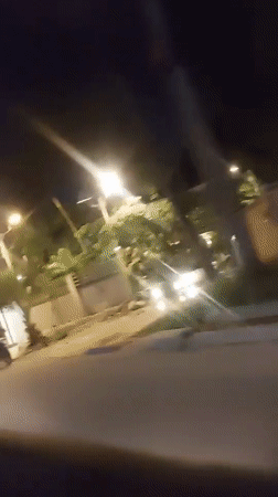 Nighttime street scene recorded from moving vehicle in Dar es Salaam