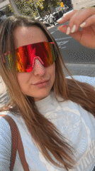 Woman films selfie with sunglasses in Barcelona street
