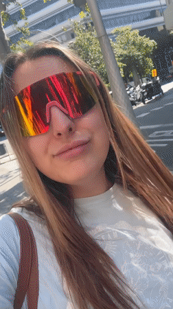 Woman films selfie with sunglasses in Barcelona street