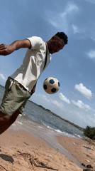 Man practices soccer tricks on Ikorodu beach