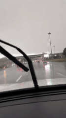 Driver caught in Moscow traffic jam during rainy afternoon