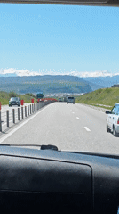 Highway travel documented near Baksan, Russia on sunny morning