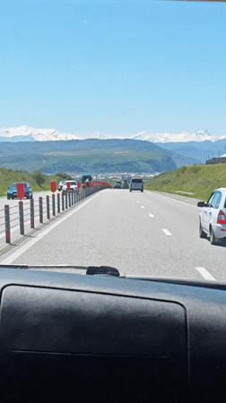Highway travel documented near Baksan, Russia on sunny morning