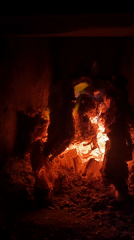 Wood fire burning in a Nyagan hearth, multiple close-up views