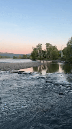 Rapids flow over rocks on river near Aya, Russia