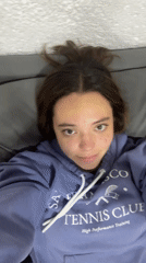 Two women share casual morning moment on couch in Cholula