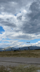 Plane passing over rural Montenegro near Podgorica Airport