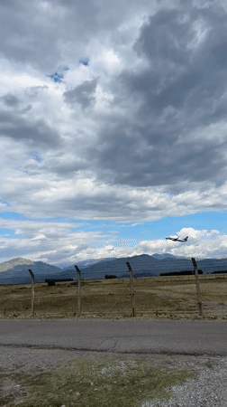 Plane passing over rural Montenegro near Podgorica Airport