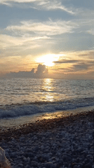 Sunset beach playtime on Sochi's pebble shore