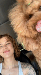 Woman films selfies with playful poodle in Montenegro