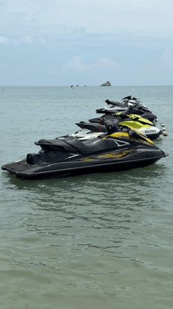 Jet skis moored in calm waters off Choeng Mon