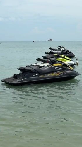 Jet skis moored in calm waters off Choeng Mon
