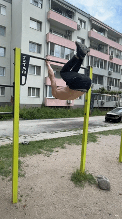Man performs gymnastics on park equipment in Plovdiv