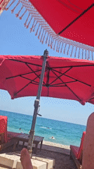 Red umbrellas and turquoise water at Konyaaltı beach