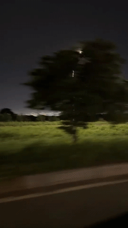 Nighttime vehicle journey recorded through Accra streets