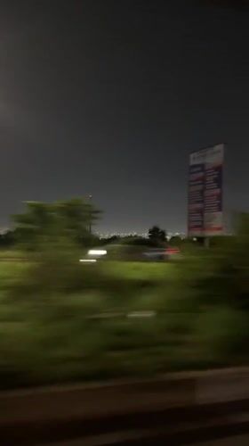 Nighttime vehicle journey recorded through Accra streets