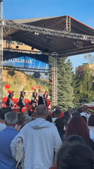 Traditional folk dancers perform outdoors in Gorna Oryahovitsa, Bulgaria