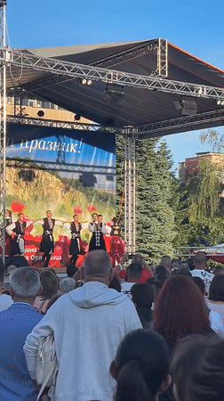 Traditional folk dancers perform outdoors in Gorna Oryahovitsa, Bulgaria