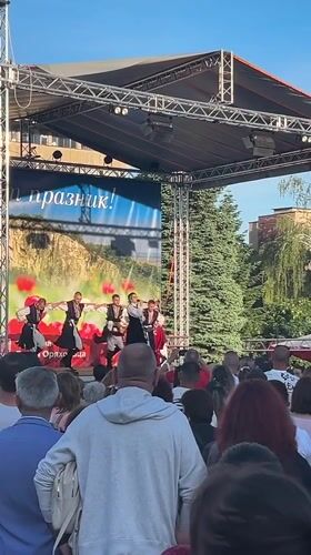 Traditional folk dancers perform outdoors in Gorna Oryahovitsa, Bulgaria