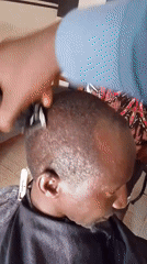 Everyday life moments captured in Jos, Nigeria barbershop and street