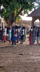 Women gather for traditional dance in Nigerian village