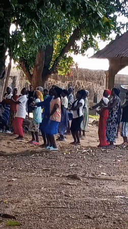Women gather for traditional dance in Nigerian village