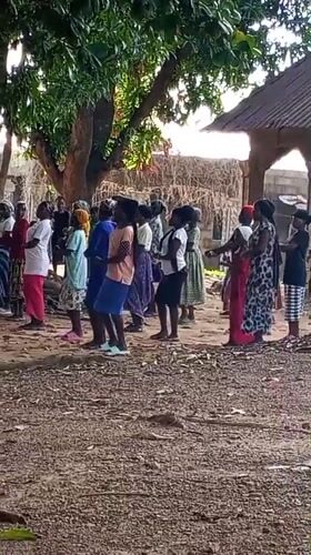 Women gather for traditional dance in Nigerian village