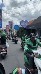 Early morning motorcycle traffic flows through North Kuta streets