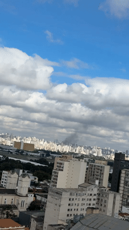 Smoke and helicopter activity observed over São Paulo cityscape