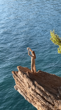 Tourists enjoy sunny afternoon at Montenegro's Sveti Stefan resort