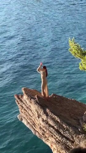 Tourists enjoy sunny afternoon at Montenegro's Sveti Stefan resort