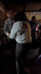 Small band plays as couples dance on patio in Saint-Priest-en-Jarez