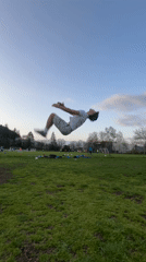 Man performs gymnastics routines on field in Troyan, Bulgaria
