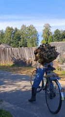 Bicycle rider moves through quiet Vereya streets on a summer morning