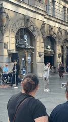 Street band performs outside Belgrade bank building