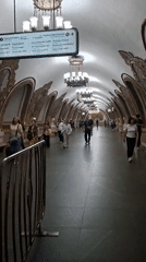 Moscow metro station, morning commute and ornate architecture