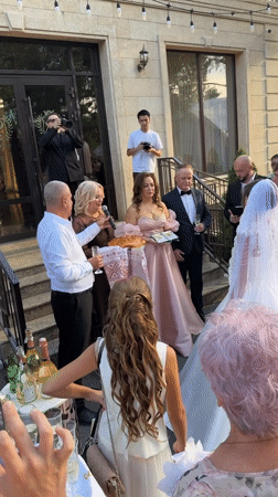 Outdoor wedding celebration in Pavlodar, complete with angel costume