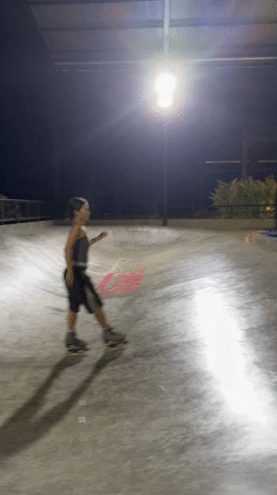 Skateboarder falls on wet concrete during rain in Dalung