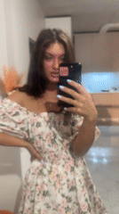 Woman takes multiple mirror selfies in residential setting