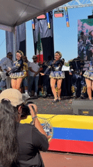 Blue and gold dance crew performs on stage in Segrate