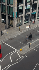 London street scene: buses, pedestrians, and city architecture