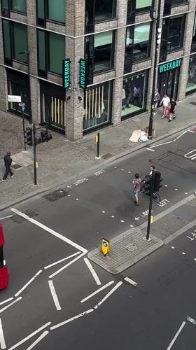 London street scene: buses, pedestrians, and city architecture